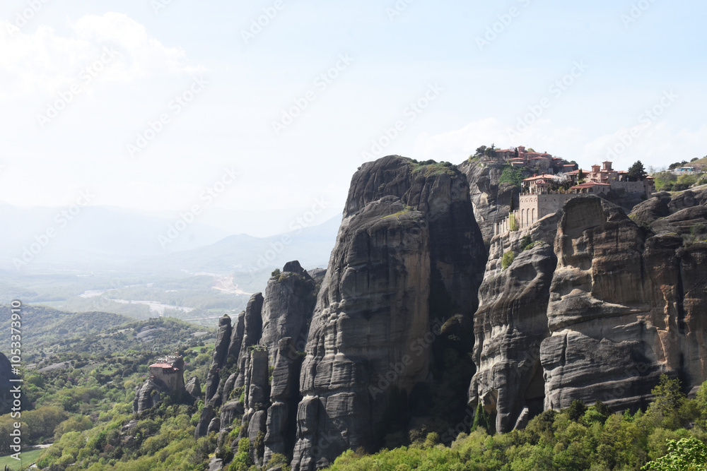 small temples sitting on top of a mountain in meteora, greece small temples sitting on top of a mountain in meteora, greece