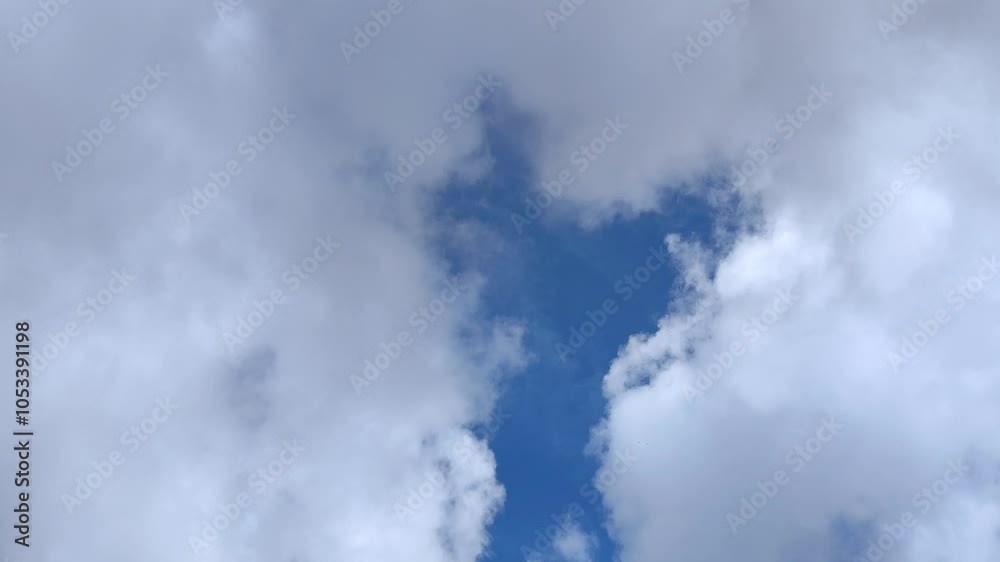 Giant gray clouds dissipate and form other smaller clouds Giant gray clouds dissipate and form other smaller clouds