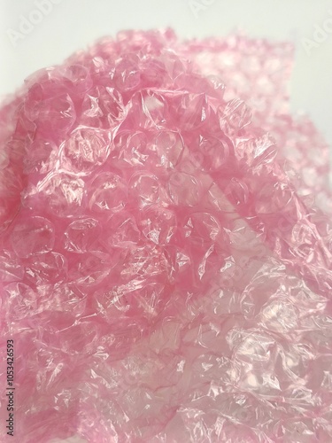 Bubble wrap close-up background photo. It is a pliable plastic material with bubbles of air used for packing fragile items. photo