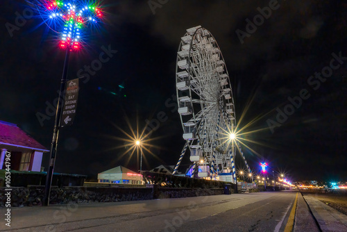 The Ferris Wheel on the promenade at night in Felixstowe, Suffolk, UK photo