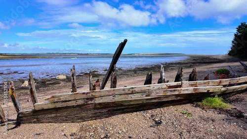 Ireland Epic Locations salt mills Bannow Bay Wexford remains of shipwreck on beach once proud fishing vessel summer walk on beach photo