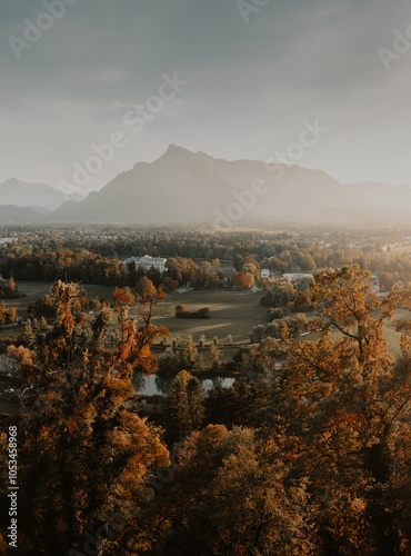 Obraz na płótnie Beautiful panoramic view of yellow fall scenery in Salzburg with Untersberg mountain in golden evening light at sunset, Austria w salonie