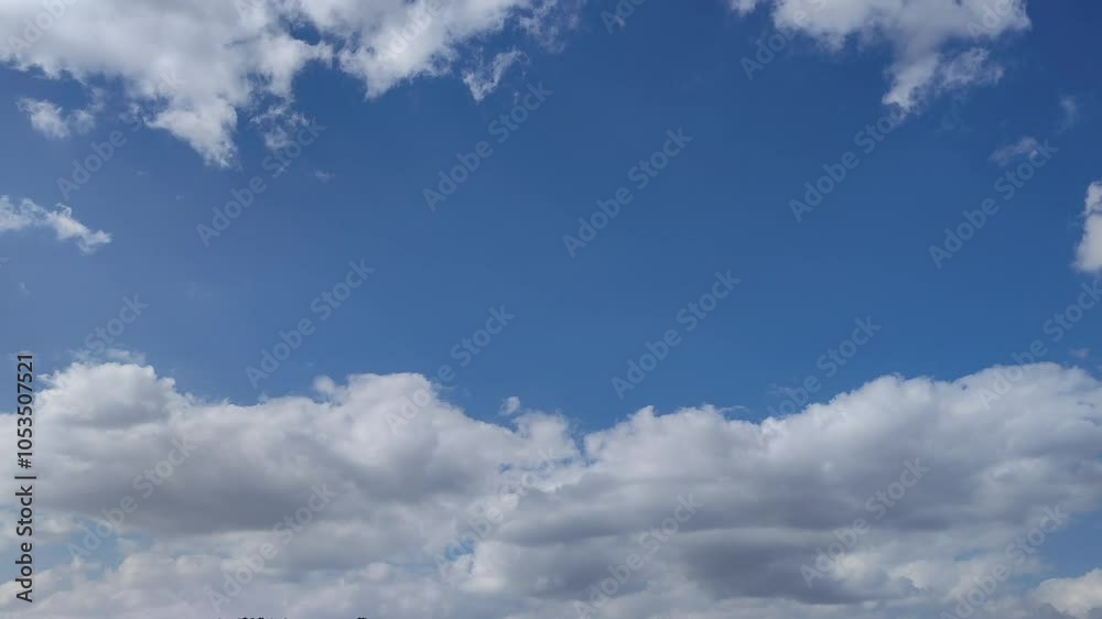 Cumulus clouds with grayish tones move across the blue sky sky blue Cumulus clouds with grayish tones move across the blue sky sky blue