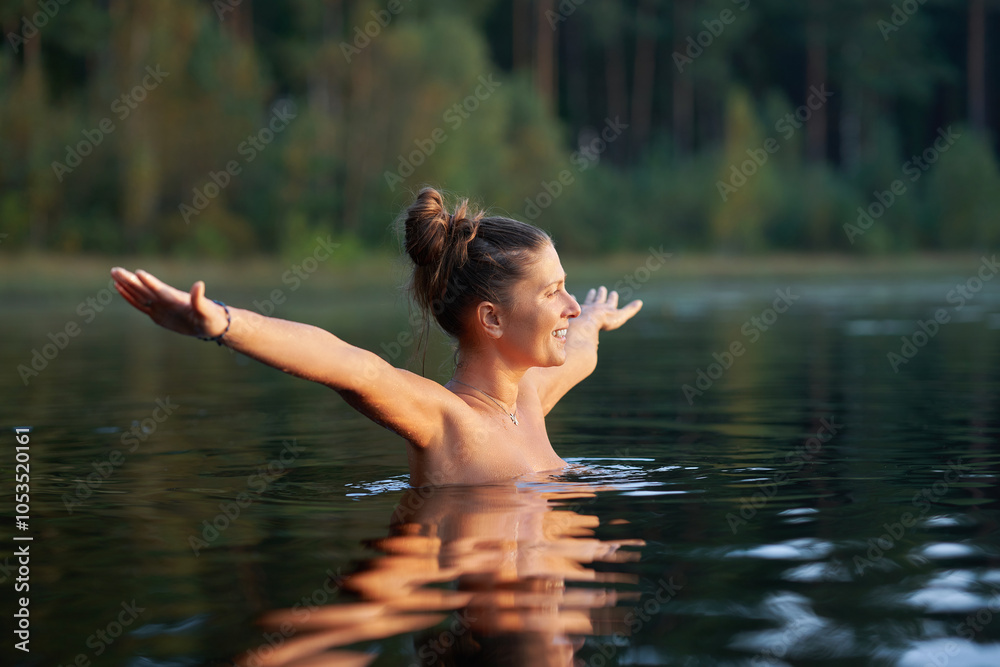 Fototapeta premium Woman in nature swimming in the lake