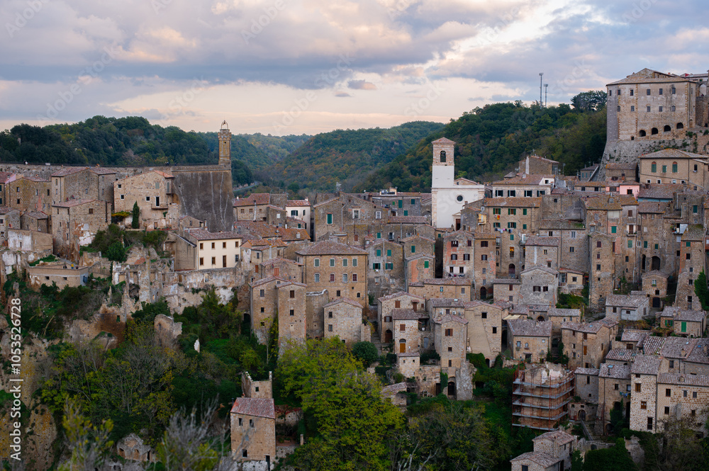 Obraz premium View of Sorano, an ancient medieval hill town composed of tuff stone over the Lente River. Etruscan town. Province Grosseto, Tuscany, Italy.