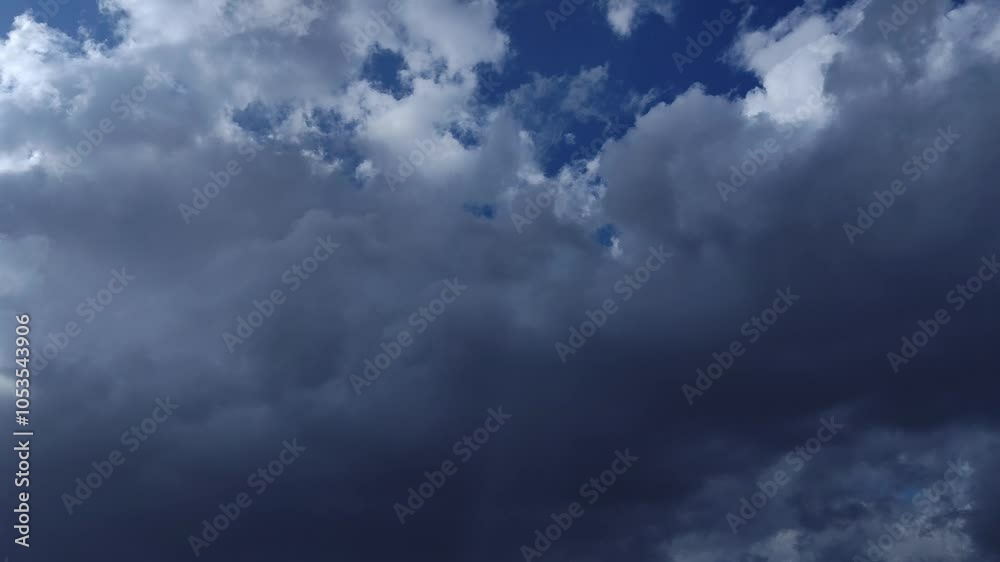 Giant black cumulus clouds moving to cover everything Giant black cumulus clouds moving to cover everything