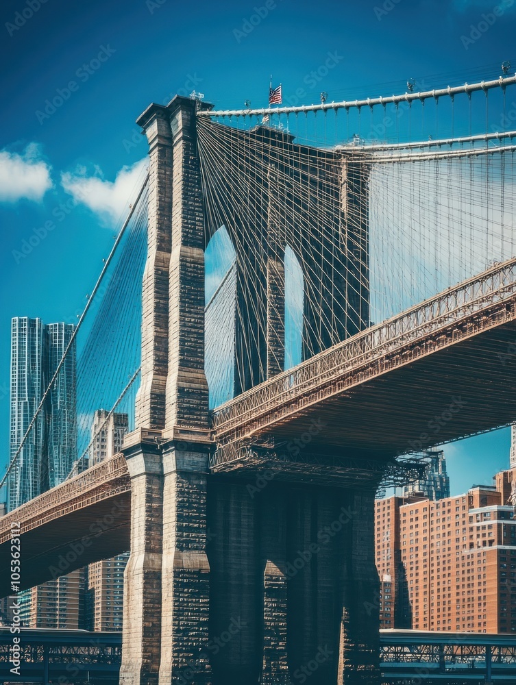 Fototapeta premium A close-up view of the Brooklyn Bridge showcasing its architectural details and city backdrop.