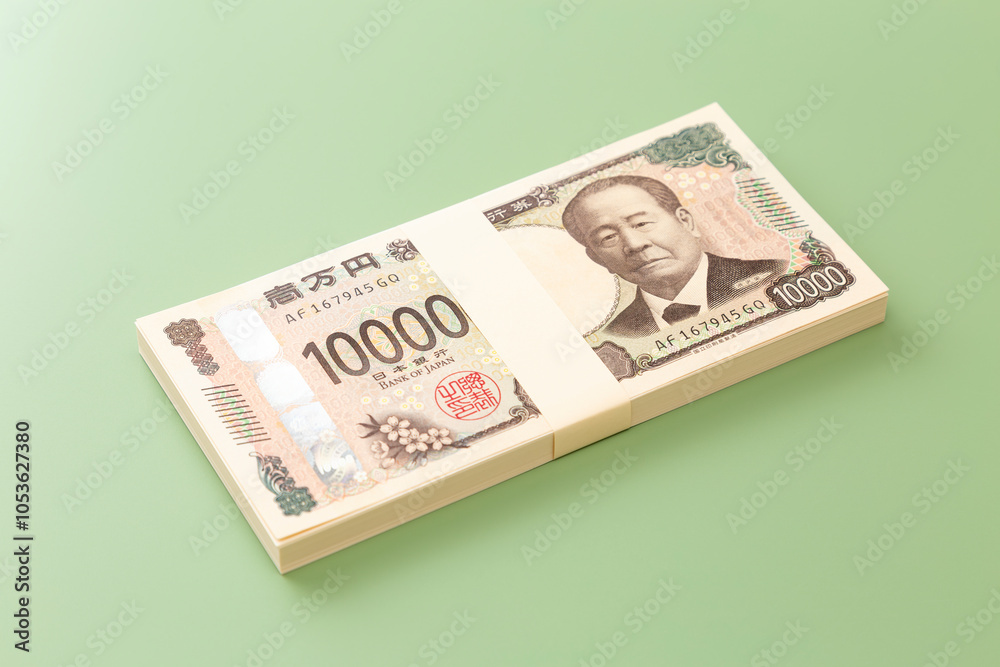 グリーン背景に一万円の札束 グリーン背景に一万円の札束