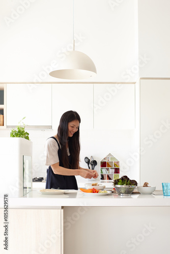 Mother in kitchen preparing meal