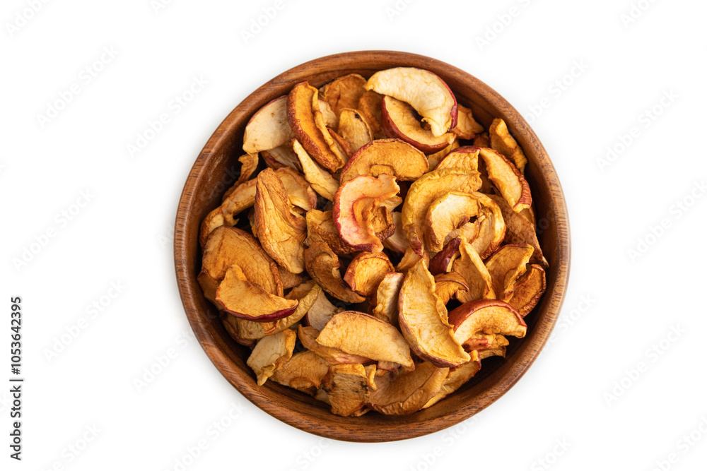 Obraz premium Dried Apples in wooden bowl isolated on white. Top view, close up