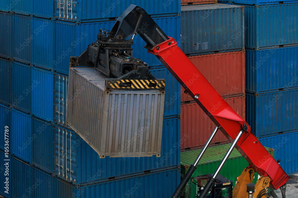 Reach stacker moves intermodal container to railroad platform. Reach stacker moves intermodal container to railroad platform.