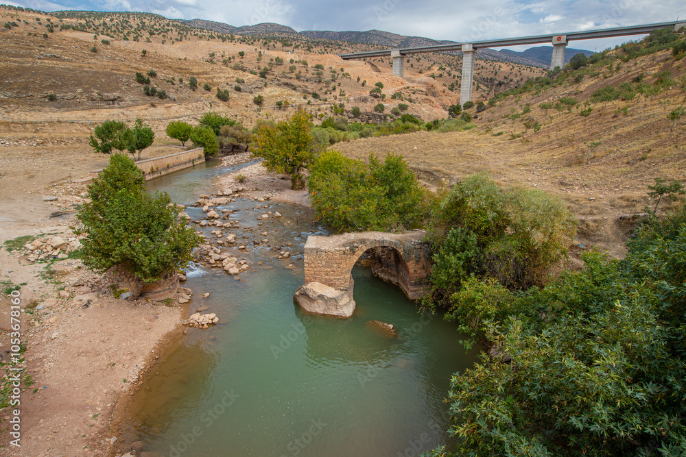 Zarava Stream and the partially collapsed old Zarava Bridge flowing in Eruh district of Siirt province, Türkiye.