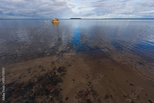 Nature of Estonia, calm on the beach of the Baltic Sea in Kaberneeme on a spring day. photo