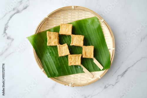 Fried tofu cubes on a skewer. photo