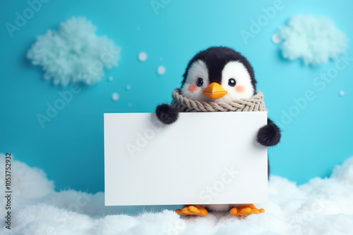 A cheerful  cute penguin holding a large blank white sign standing at the right corner with a snowy cyan solid bright background. copyspace.