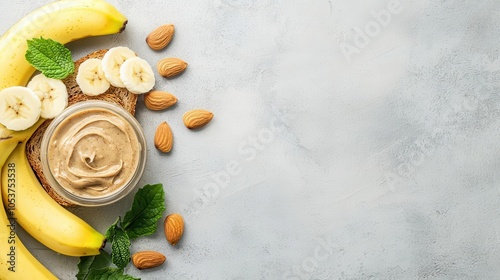 Almond butter spread on whole grain toast with bananas, vegan ingredients, vegan breakfast concept photo