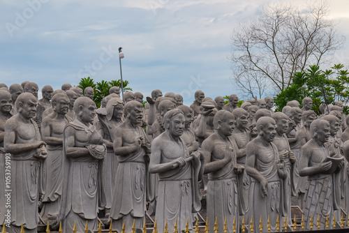 Large group of statues of monks or religious figures arranged in rows in buddhist temple Patung Seribu (Vihara Ksitigarbha Bodhisattva, 500 Lohan Temple) on Bintan Island, Indonesia. Tanjung Pinang photo