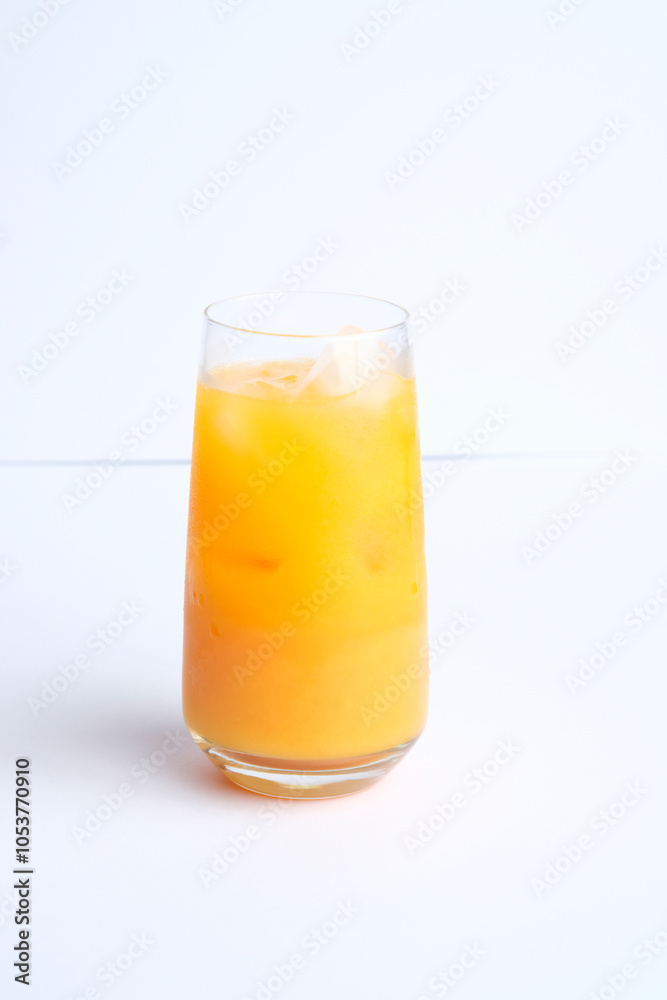 Full glass of ice and orange juice