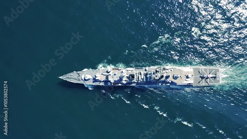 Aerial view of naval ship, battle ship, warship, Military ship resilient and armed with weapon systems, though armament on troop transports. support navy ship. Military sea transport.