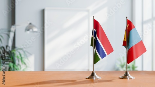 FLAGS OF GAMBIA AND MONGOLIA ON TABLE photo