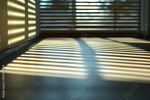 Morning sunlight casts stripes on the floor through blinds photo