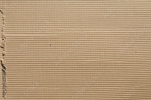 Paper texture, background is beige recycled cardboard