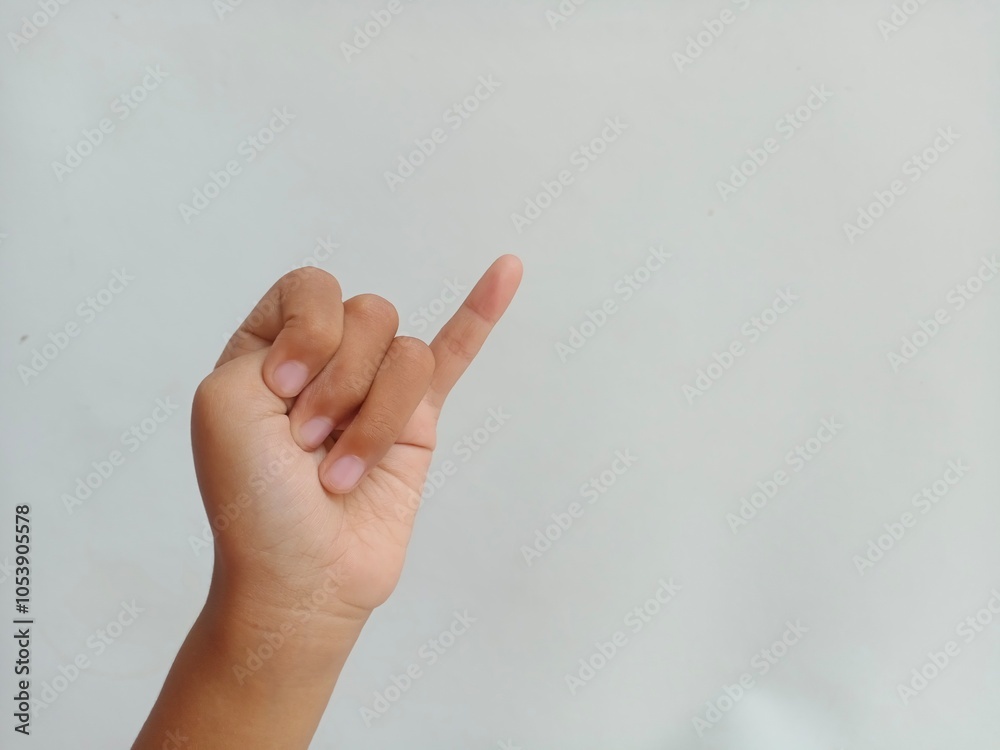 Asian kid's hand do Pinky promise symbol or pinkie swear hands gesture on white background, with copy space Asian kid's hand do Pinky promise symbol or pinkie swear hands gesture on white background, with copy space