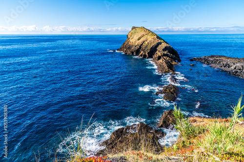 A view from the lookout along the length of the Dog Face islet on the island of San Miguel in the Azores in summertime photo