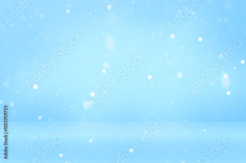 Light blue snowy soft focus background with empty space. Abstract backdrop with snowflakes for product display, advertising or presentation