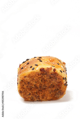 Soft savory bread topped with sesame seeds and coated with shredded beef floss on both sides. Photographed against a white background, offering a deliciously textured look.