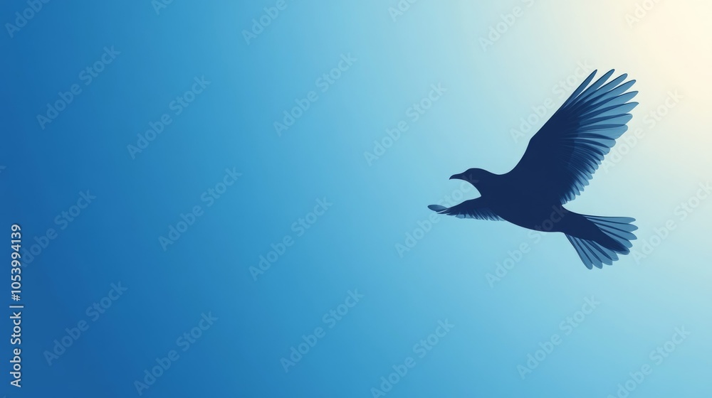 Obraz premium Silhouette of a bird in flight against a gradient blue sky.
