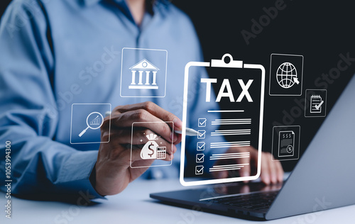 Income tax, Businessman calculates taxes using calculator and laptop. Icons related to finance, tax documents, and savings, represent the concept of tax return preparation and financial management. photo