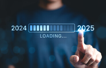 Progress and transition from 2024 to 2025 concept. A person pointing to loading bar transitioning from 2024 to 2025, progress, future planning, and new year goals. annual planning and business growth.
