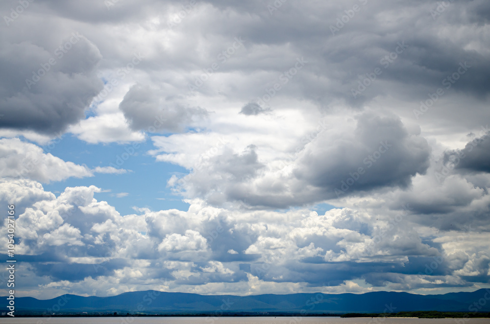 Large clouds against a light sky Large clouds against a light sky