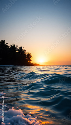Golden hour over ocean waves and palms