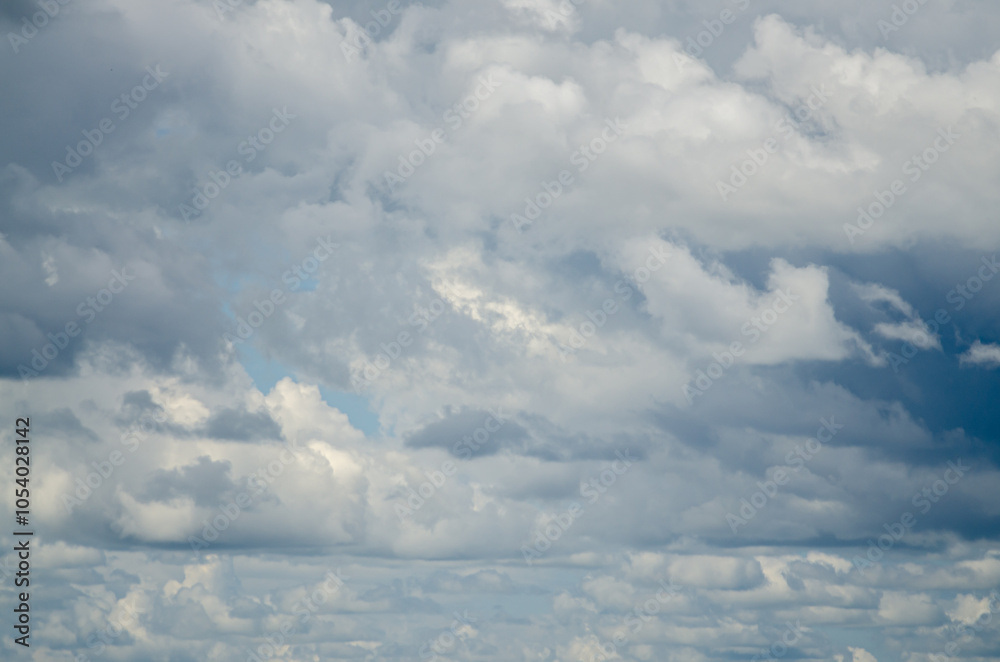 Fototapeta premium Large clouds against a light sky