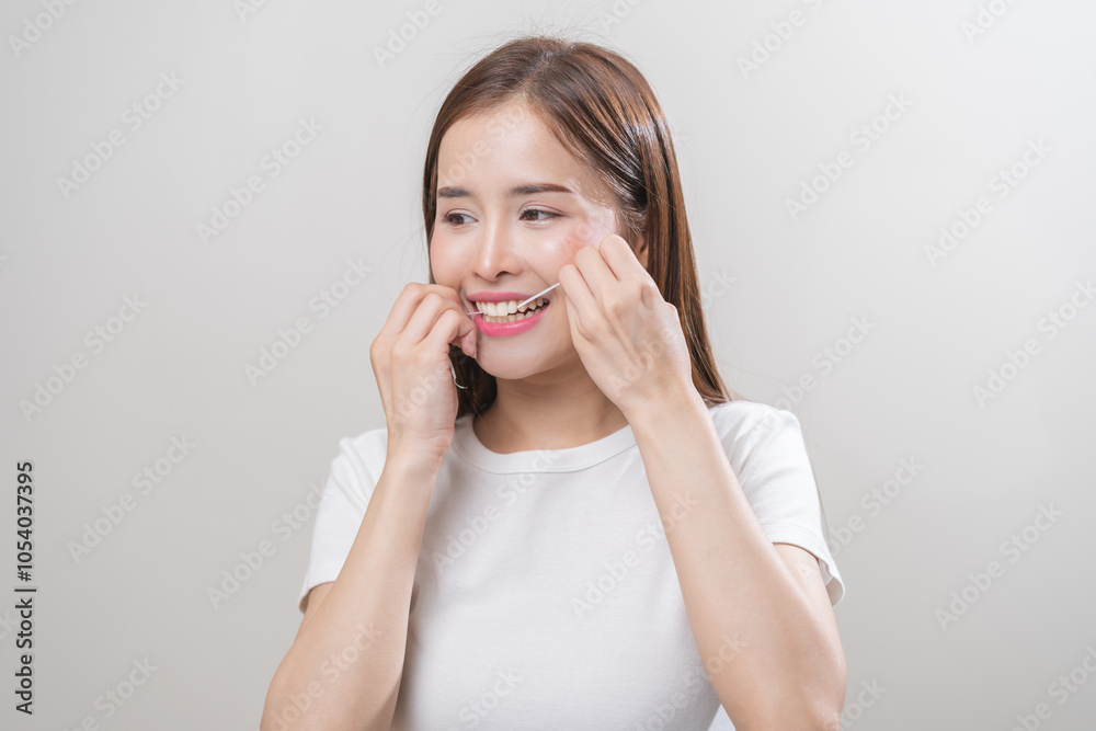 Flossing teeth, dental care hygiene concept, asian young woman flossing teeth with dental floss, smile happy with perfect white teeth, using tooth floss cleaning, healthy teeth isolated on background. Flossing teeth, dental care hygiene concept, asian young woman flossing teeth with dental floss, smile happy with perfect white teeth, using tooth floss cleaning, healthy teeth isolated on background.
