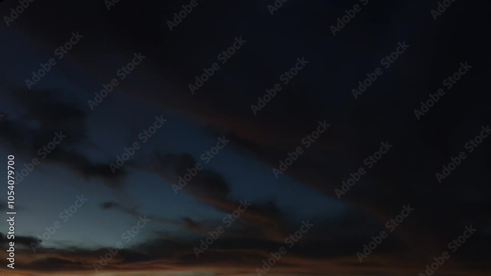 Landscape from a horror movie with the sky filled with orange cirrus clouds at dusk