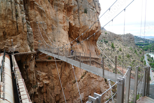 Steel suspension bridge between the vertical rock faces on the Kings Walkway or El Caminito del Rey in the province of Malaga, Andalusia, southern Spain.