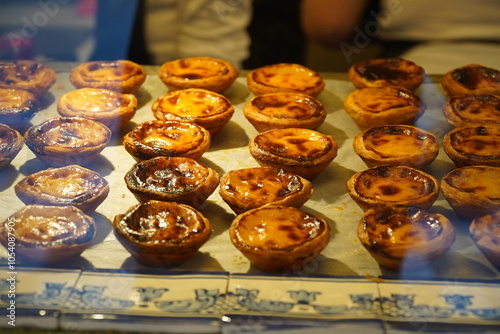 Portuguese Custard Tarts (Pastel de Nata), a traditional portuguese pastry. Albufeira, Algarve, Portugal. photo