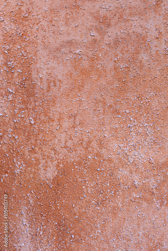 Wall with cream texture. The wall is made of cement and has a rough surface.