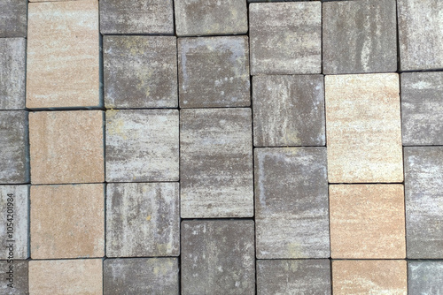 Top view of textured paving stones in various colors, showcasing a modern urban design. Ideal for backgrounds or architectural themes. photo