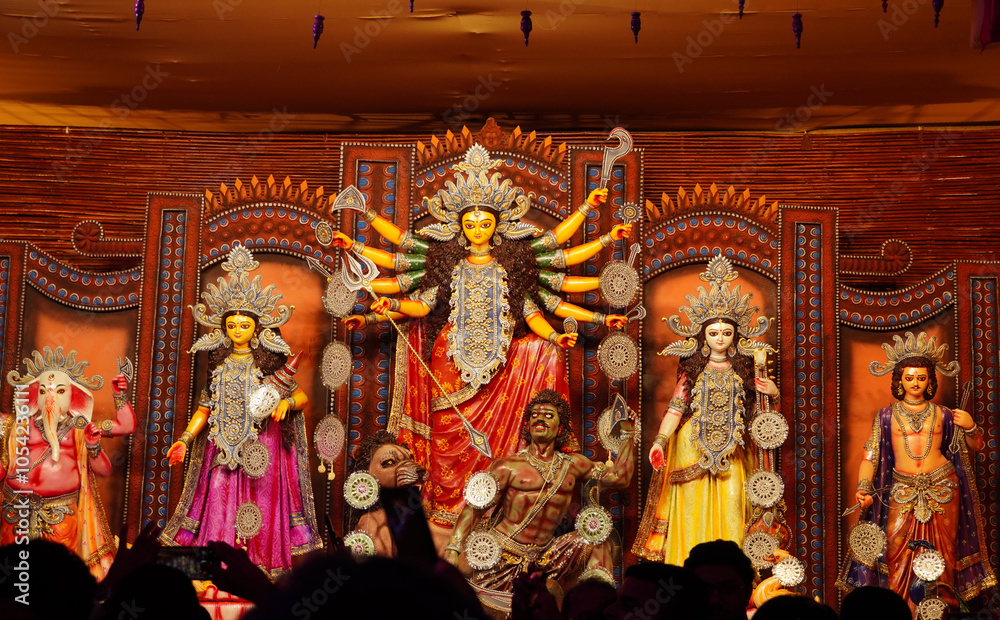 Fototapeta premium in durga pandel , idol of indian goddess durga with other goddess killing mahishasur in durga pooja