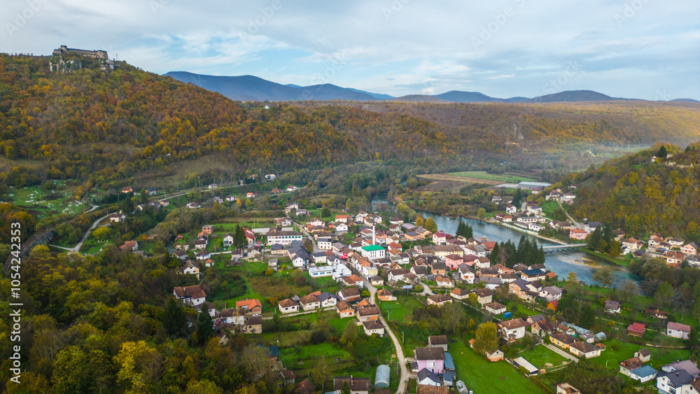 Fototapeta premium Kulen Vakuf and the ancient fortress Stari Grad Ostrovica, viewed from the air, reveal a captivating blend of history and natural beauty in Bosnia and Herzegovina. The aerial perspective captures