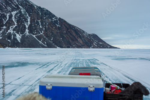 Frozen Landscape with Mountainous Background and Equipment