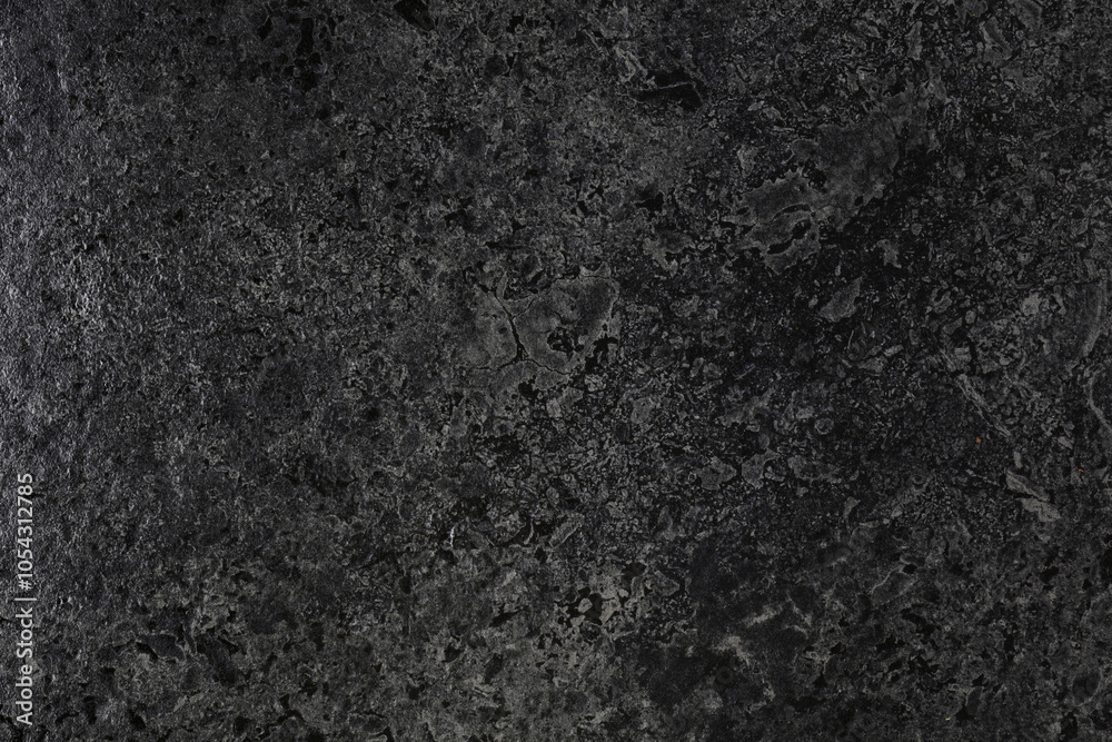 Smooth and polished black stone. Smooth and polished black stone.