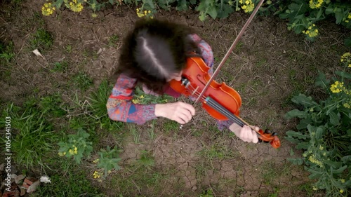 Young Lady Violin Player Practicing in Nature Top Down Shot