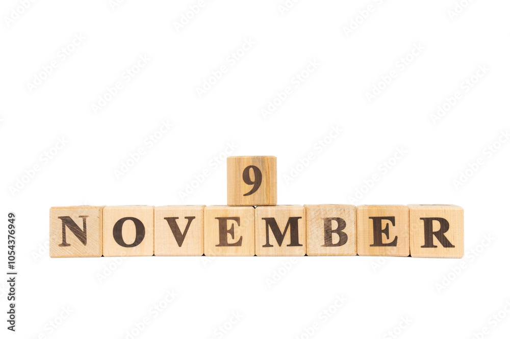 November 9, Wooden cube on isolated white background. Book, Colleen Hoover, opening of the Berlin Wall, Cambodia Independence Day, Eleven09 Day, British Pudding Day November 9, Wooden cube on isolated white background. Book, Colleen Hoover, opening of the Berlin Wall, Cambodia Independence Day, Eleven09 Day, British Pudding Day