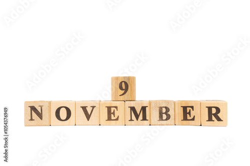 November 9, Wooden cube on isolated white background. Book, Colleen Hoover, opening of the Berlin Wall, Cambodia Independence Day, Eleven09 Day, British Pudding Day