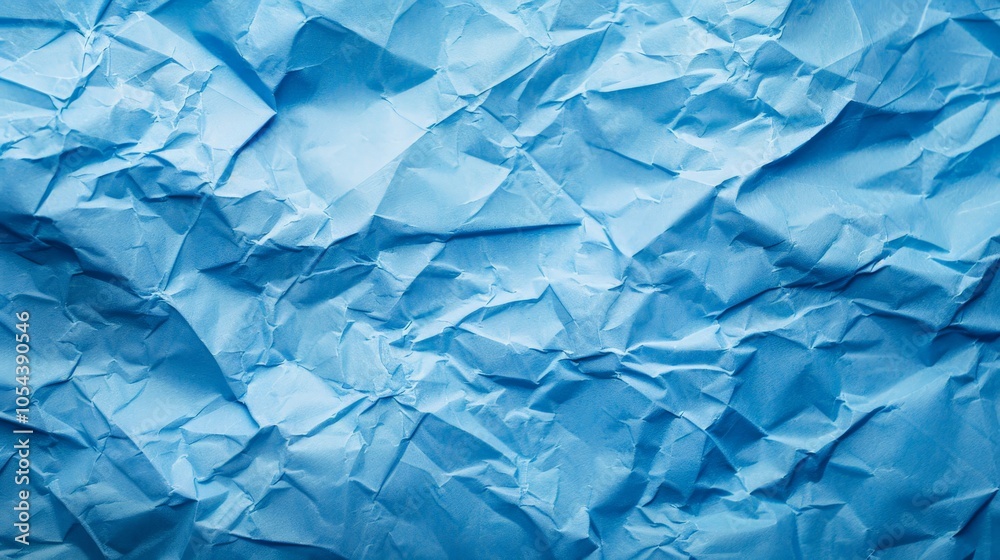 Obraz premium Sky blue paper with creases and folds for a simple, artistic background